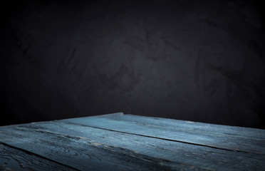 Old wood table top with smoke in the dark background.