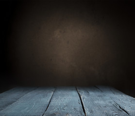 Old wood table top with smoke in the dark background.