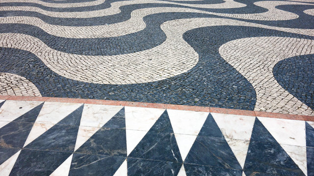 Lisbon waves Handmade pavement (Calçada portuguesa). Padrao dos Descobrimentos - Monument to the Discoveries in Belem, Lisbon, Portugal