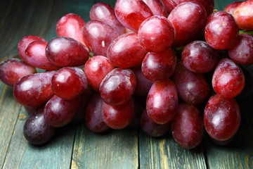 red grape on the wood table