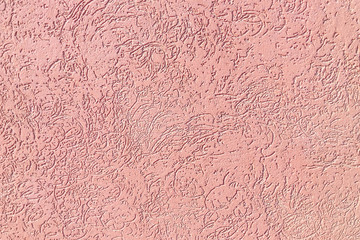 Texture pink stucco patterns on the surface of interior walls