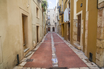 Fototapeta na wymiar Ancient street in historic center of Tarragona,Catalonia.Spain.