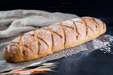 Dietic bread with nuts on wooden background