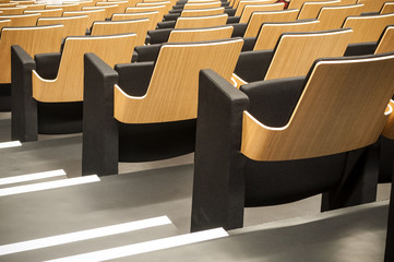 closeup of wooden seat alignment  in auditorium
