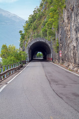 Fototapeta na wymiar holidays in Italy - a view of the most beautiful lake in Italy, Lago di Como. View of tunnel.