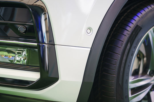 Parking sensor, front bumper, lights and details of lighting, plastic and metal.