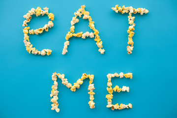 Food. Frozen Popcorn Corn Popcorn bucket. Delicious Popcorn on Blue Background. Cinema. Eat me