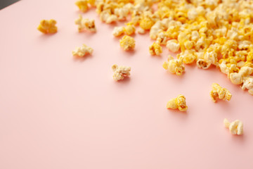 Food. Frozen Popcorn Corn Delicious Yellow Popcorn on Pink Background. Cinema. Copyspace. Place for Text.