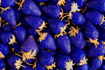Tasty strawberry on a wooden table. It can be used as a background