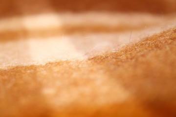 Woolen plaid for the sofa. Background.