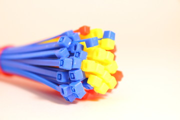 Screed plastic. Clamp. Close-up. Isolated on white background.