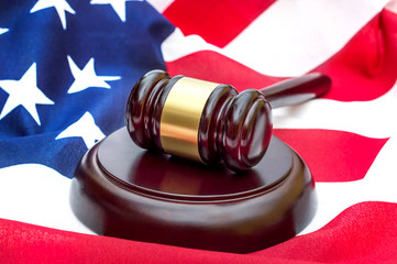 Judge's gavel on american flag. American law.