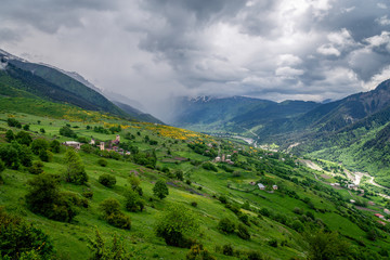 Fototapeta na wymiar Dramatic weather and scenery whilst hiking in the Svaneti region of Georgia.