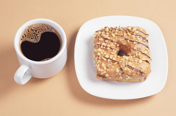 Square donut with glaze and coffee