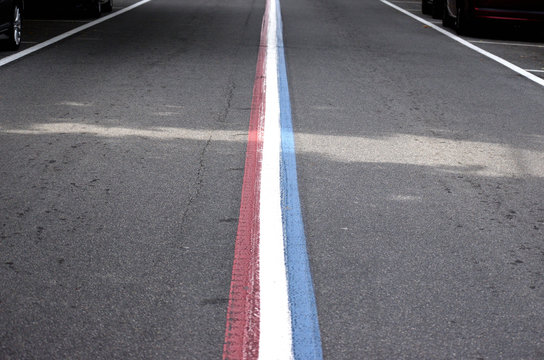 Street patriotically painted in red, white and blue for the 4th of July parade.