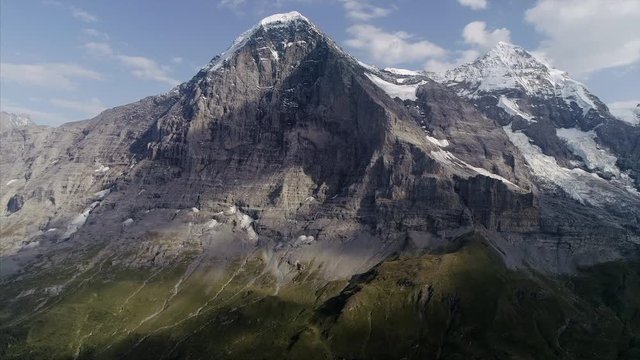 Mannlichen, Kleine Scheidegg,View of Eiger, Switzerland. Wide shot of Eiger, Bernese Oberland. Few Clouds, blue sky. Eiger mountain is known as one of the six north faces of the Alps.