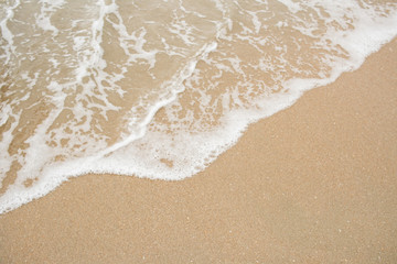 Fototapeta na wymiar Sand and sea wave