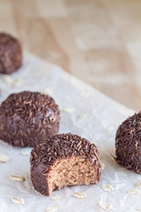 Swedish sweets Arrack balls, made from cookie crumbs, cocoa, butter and coconut wine Arrack flavour, vertical, copy space