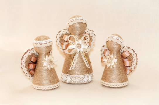 angel handmade souvenir, wrapped in rope and decorated with lace