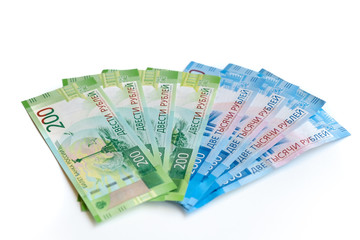 new Russian banknotes in denominations of 200 and 2000 rubles close-up on a white background, top view