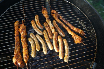 Sausages barbecue with a charcoal barbecue in the garden

