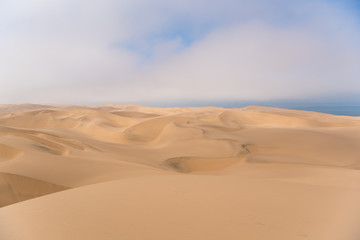 Naklejka na ściany i meble Namib Desert dunes meet the ocean, Namibia, Africa
