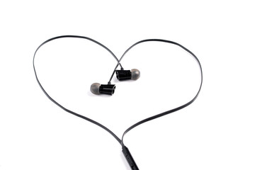 Black headphones in the shape of a heart on a white background.