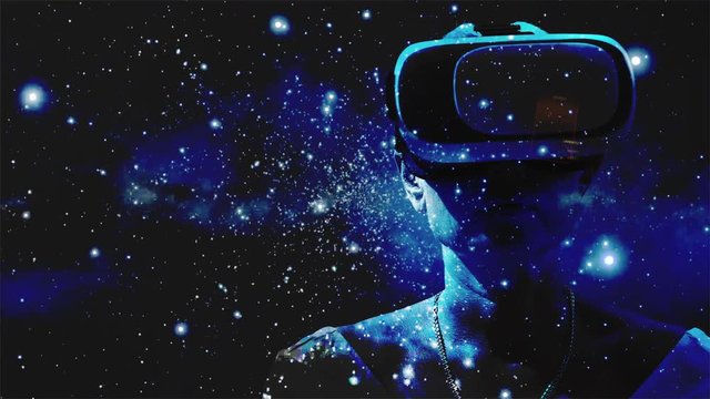 Woman using virtual reality glasses with graphics effects