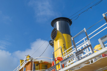 Ancient formar naval research vessel in  a port in sunlight in spring