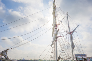 Fototapeta premium Rigging of a tall ship in a port in sunlight in spring