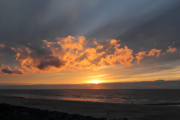 sunset by sea with super cloud