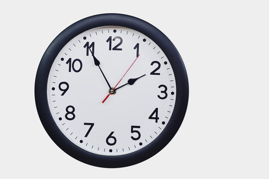 Time concept with black clock at five to two am or pm