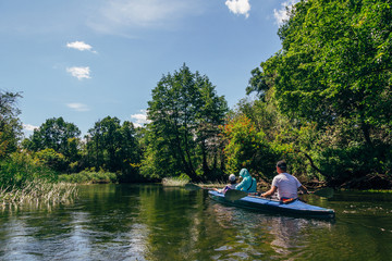 Fototapeta na wymiar Kayaking on river in forest