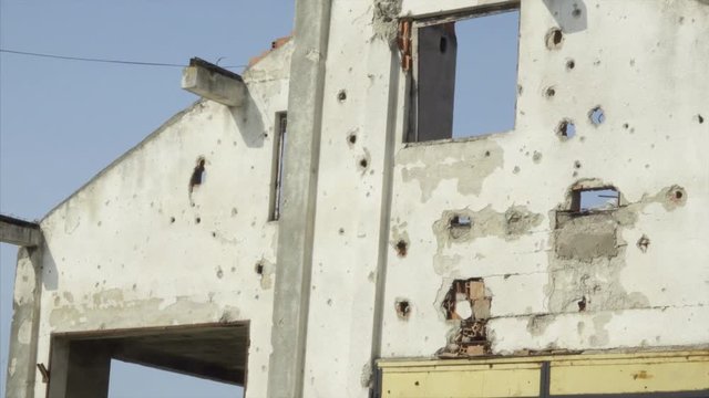 Close Up of a White Building Damaged From Kosovo Conflict in Kline