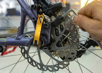 Fototapeta premium Bicycle Maintenance- Repairing the Disc Brakes on a Mountain Bike