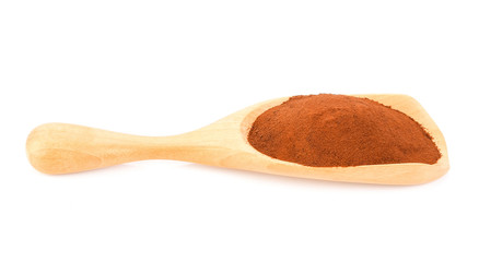 Coffee powder in wood scoop isolated on white background