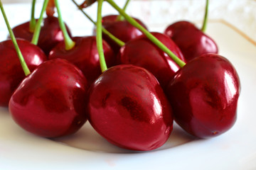 Delicious, sweet red cherries. Juicy red berries of fresh ripe cherry.