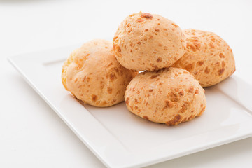Brazilian cheese buns in white background. Pao de queijo.