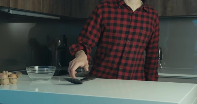 Funny hipster man dancing and spinning in kitchen