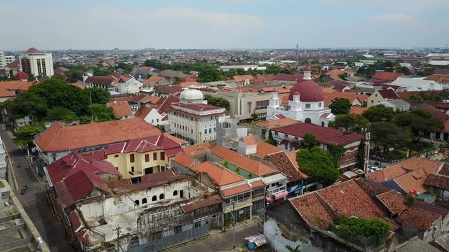 Flying over old Dutch colonial quarter in Semarang, towards Christian church in Semarang, Indonesia