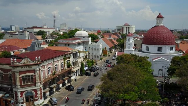 Flying towards Dutch colonial church and old warehouses in Semarang, Indonesia
