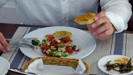 Young woman and man eating healthy and delicious salad
