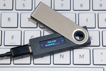 Cryptocurrency Hardware Wallet On Laptop Keyboard