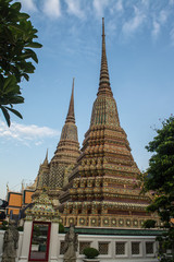 Fototapeta premium Pagoda is in Wat Pho that was named as the temple of the pagoda or chedi that are decorated with yellow glaze or glazed tiles or dark blue. 