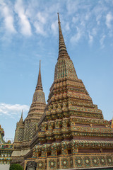 Fototapeta premium Pagoda is in Wat Pho that was named as the temple of the pagoda or chedi that are decorated with yellow glaze or glazed tiles or dark blue. 