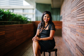 Corporate portrait head shot of a confident and attractive Indian Asian business woman. 