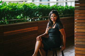 Fototapeta premium Corporate portrait head shot of a confident and attractive Indian Asian business woman. 
