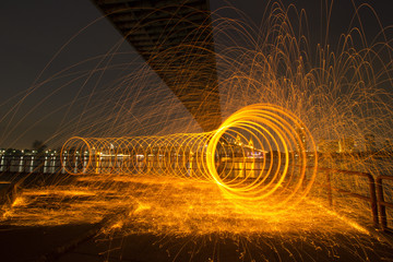 Tunnel shape of long Exposure Photography using Steel Wool Burning at night.