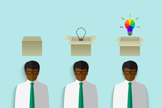 Thinking out of the box concept with black businessman having a cardboard box above his head and colorful lightbulb as creative idea symbol