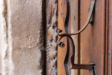 church brown wooden door with handles details